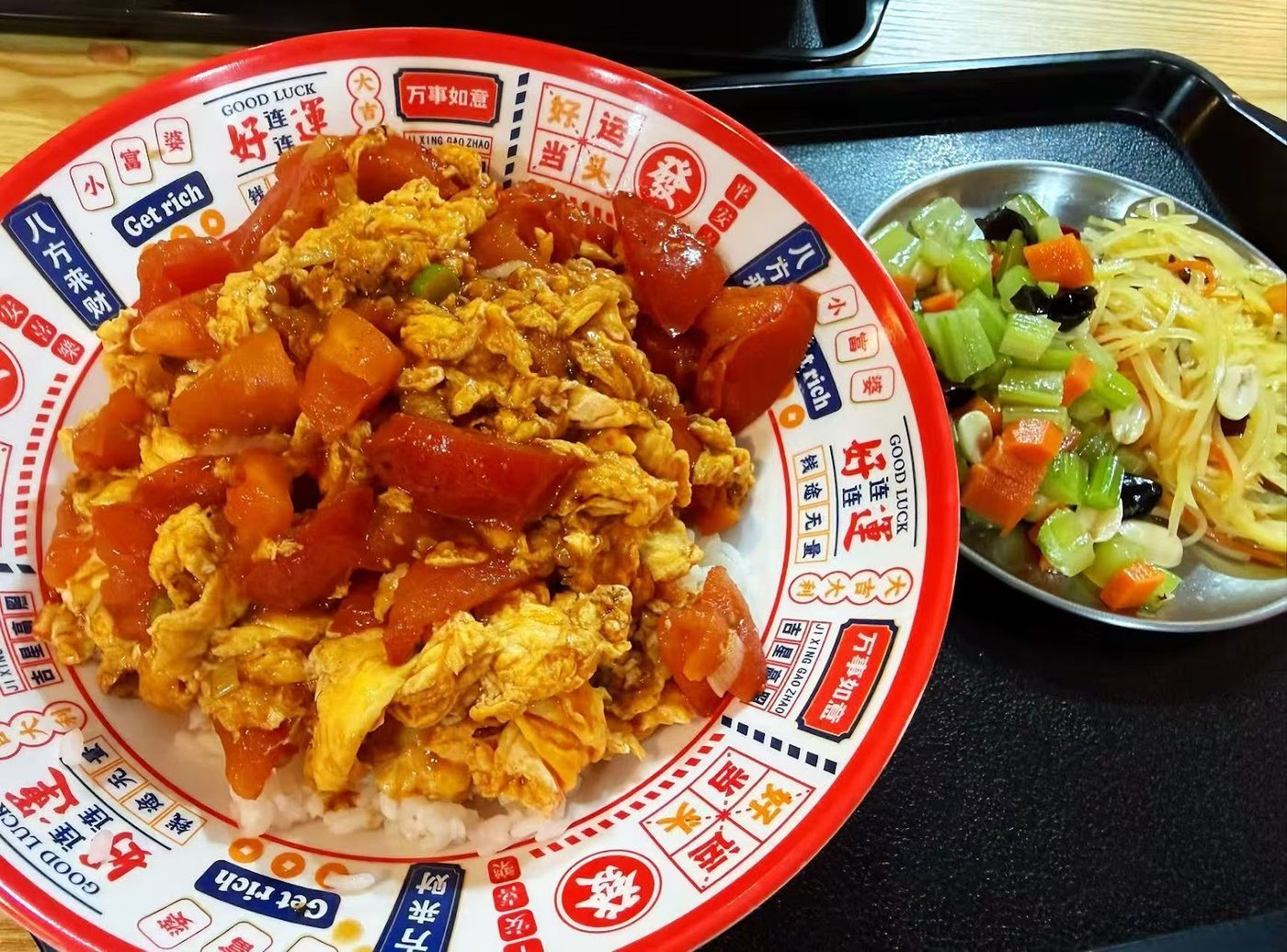 A rice plate with meat, vegetables and side salad at Bomb Fried Skewers