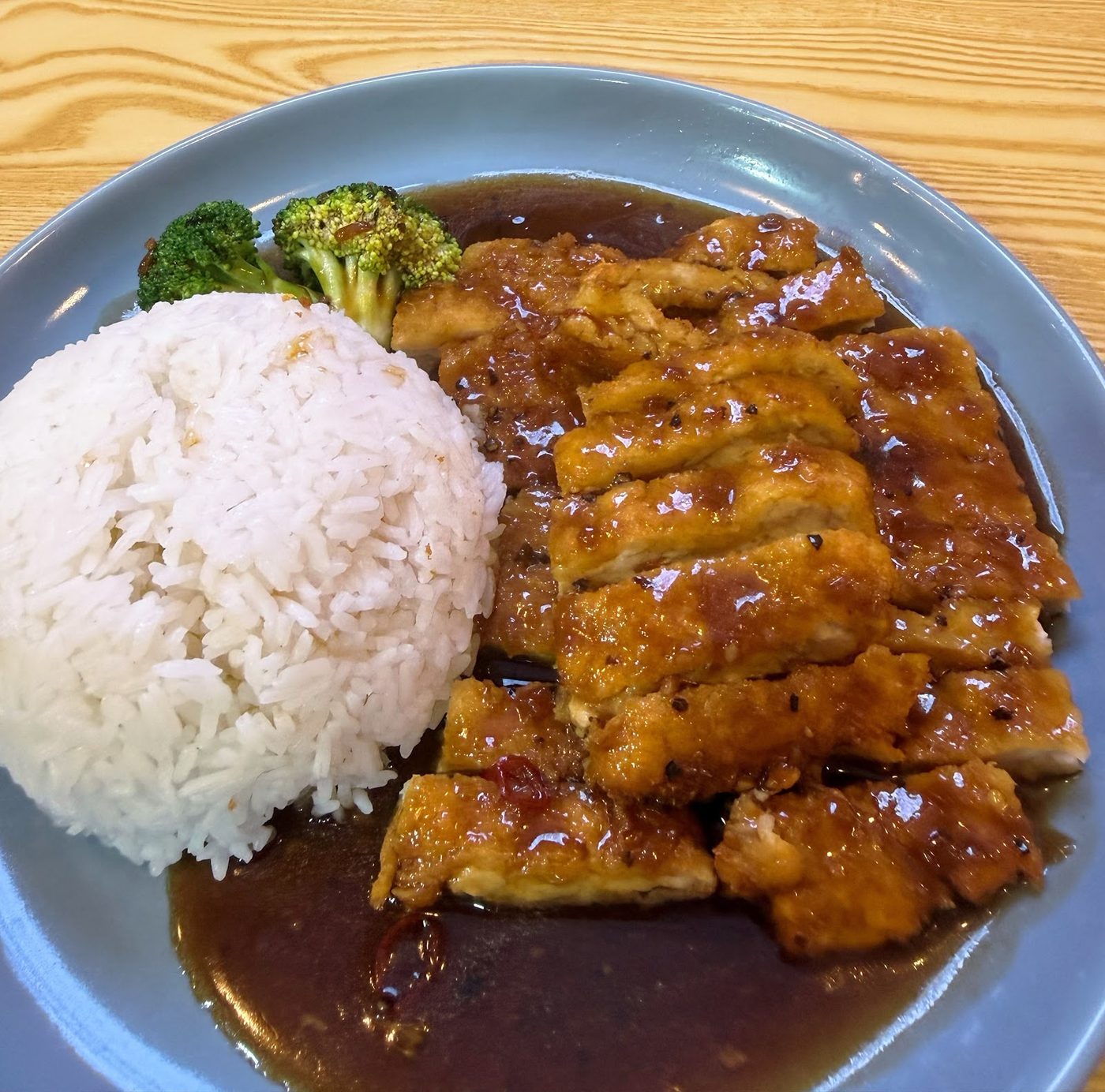 A rice meal with glazed meat at Bomb Fried Skewers